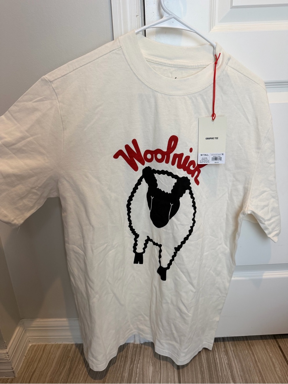 Woolrich Cream Short Sleeve Tee with Red Logo and Black Sheep Graphic
